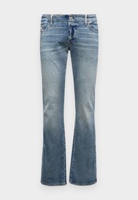 Modre bootcut kavbojke iz svetlega denima, s srednje visokim pasom, zbledelim videzom in diskretnimi šivi na sprednjih žepih.