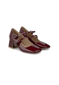 Scarpe con tacco Mary Jane in vernice borgogna, con punta quadrata, due sottili cinturini alla caviglia e dettagli decorativi sui lati. Design con tacco spesso e squadrato.