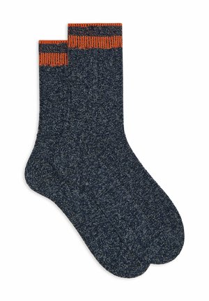 Calzini blu navy con polsini a costine arancioni, caratterizzati da un motivo a maglia testurizzato. Il design è di lunghezza media fino al polpaccio con punta arrotondata.