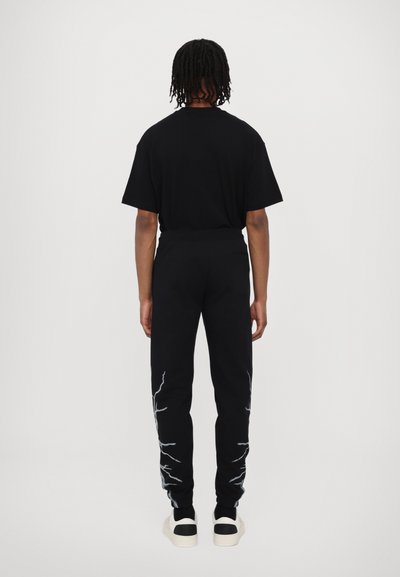 PHOBIA ARCHIVE PANTS WITH LATERAL WHITE LIGHTNING PRINT AND EMBROIDERY GOTIC LOGO - Donji dijelovi trenirke - black/white