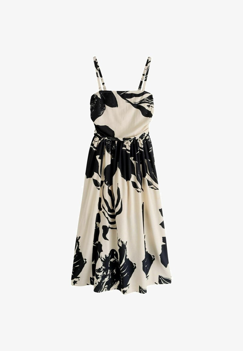 Robe midi sans manches avec fines bretelles en tissu crème, ornée d'un grand imprimé floral noir audacieux et d'une taille froncée.