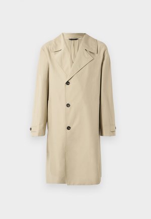 Beige trenchcoat met een gekartelde revers, dubbel-breasted knoopsluiting, lange mouwen en zijzakken. Glad stof met een getailleerde pasvorm.