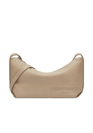 Beige leather shoulder bag with a curved design. Features embossed logo, a single strap, and smooth texture. Zipper closure at the top.