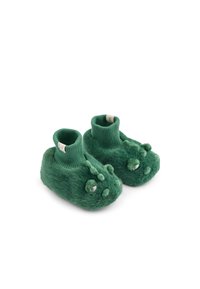 Zaļi fuzzy bērnu čības ar ribotām potīšu lencēm, izstrādātas ar dinozauru sejām un 3D acīm un ērkšķiem augšpusē.