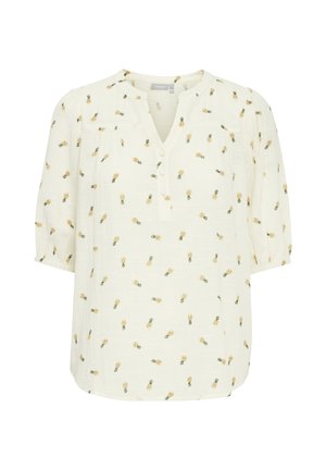 Bela bluza z rumenimi vzorci ananasa. Ima V-izrez, platišče z gumbi na tri in polkrvalne rokave z elastikami na manšerah.
