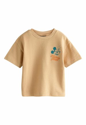 Beige short-sleeve knit top with round neck, featuring a small blue Mickey Mouse head and orange "Mickey Mouse" text on the left chest.