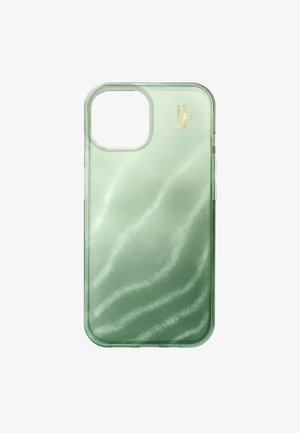 Przezroczyste zielone etui na telefon z prostokątnym wycięciem na aparat i złotym logo "iDeal of Sweden" w prawym górnym rogu.