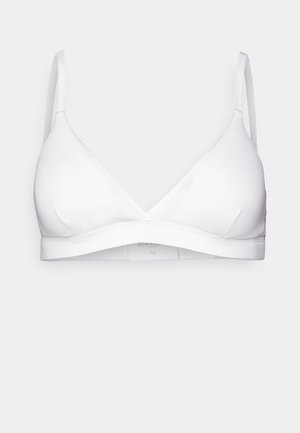 Biała balkonetka o bezszwowym designie, trójkątnych miseczkach, regulowanych cienkich ramiączkach i szerokiej gumie pod biustem. Wykonana z miękkiego, elastycznego materiału.