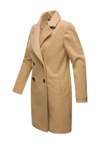 Beige dubbelknäppt kappa med slitskragen, två framfickor och svarta knappar. Har textil med struktur och märkesdetalj på ärmen.