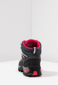 Mid-top hiking boots with a black synthetic upper, pink lined collar, and gray accents. Features textured grip sole and adjustable straps.