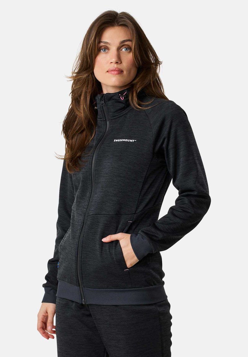 Black zip-up jacket with a high collar, featuring two side pockets and ribbed cuffs. Logo displayed on the chest in white.