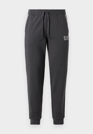 Tamno sivi jogger hlače, sužene na dnu, s pojasom na vezanje, manžetama na gležnjevima, bočnim džepovima s trakastim oblogama i bijelim EA7 Emporio Armani logom na bedrima.