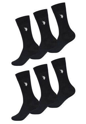 Sechs schwarze Crew-Socken mit einem weißen, gestickten Logo eines Polospielers auf einem Pferd an der Seite.