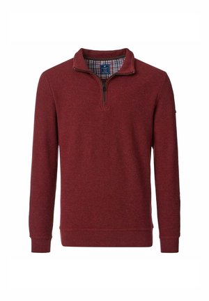 Roter Pullover mit Reißverschlusskragen, gerippter Textur, langen Ärmeln und einem karierten Futter auf der Innenseite des Kragens.