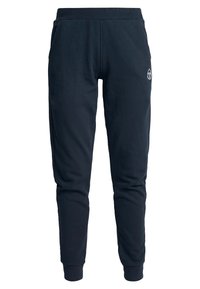Marineblauwe sweatpants met een taps toelopend ontwerp, gemaakt van zacht materiaal. Voorzien van een elastische tailleband en ribgebreide boorden. Inclusief een klein logo-detail.