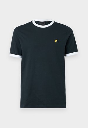 Marineblå bomulls-T-skjorte med hvit ribbestrikket krage og ermekanter. Har en liten gul brodert logo på venstre bryst.