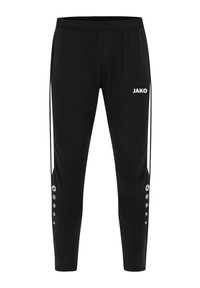 Pantalons de sport noirs à coupe fuselée. Équipés d'une taille élastique, d'un logo blanc, de bandes latérales et de boutons décoratifs sur le bas de la jambe.