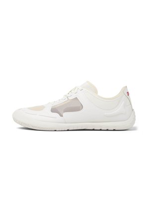 White athletic shoe with mesh panels, curved design, textured sole, and subtle beige accents. Features a lace-up closure and logo detail.