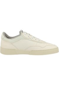 Light-colored sneaker with a perforated leather upper, soft gray lining, flat laces, and a textured rubber sole. Classic low-top design.