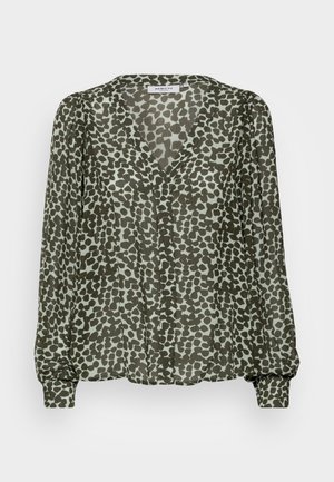 Green blouse in lightweight fabric featuring a black and pale green animal print, v-neck, and long sleeves with gathered cuffs.