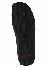 Black rubber shoe sole featuring a textured zigzag pattern, with a red logo label and size markings embossed on the surface.