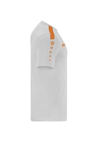 Chemise blanche à manches courtes avec une bande orange sur l'épaule et des accents circulaires sur la manche, fabriquée dans un matériau doux.