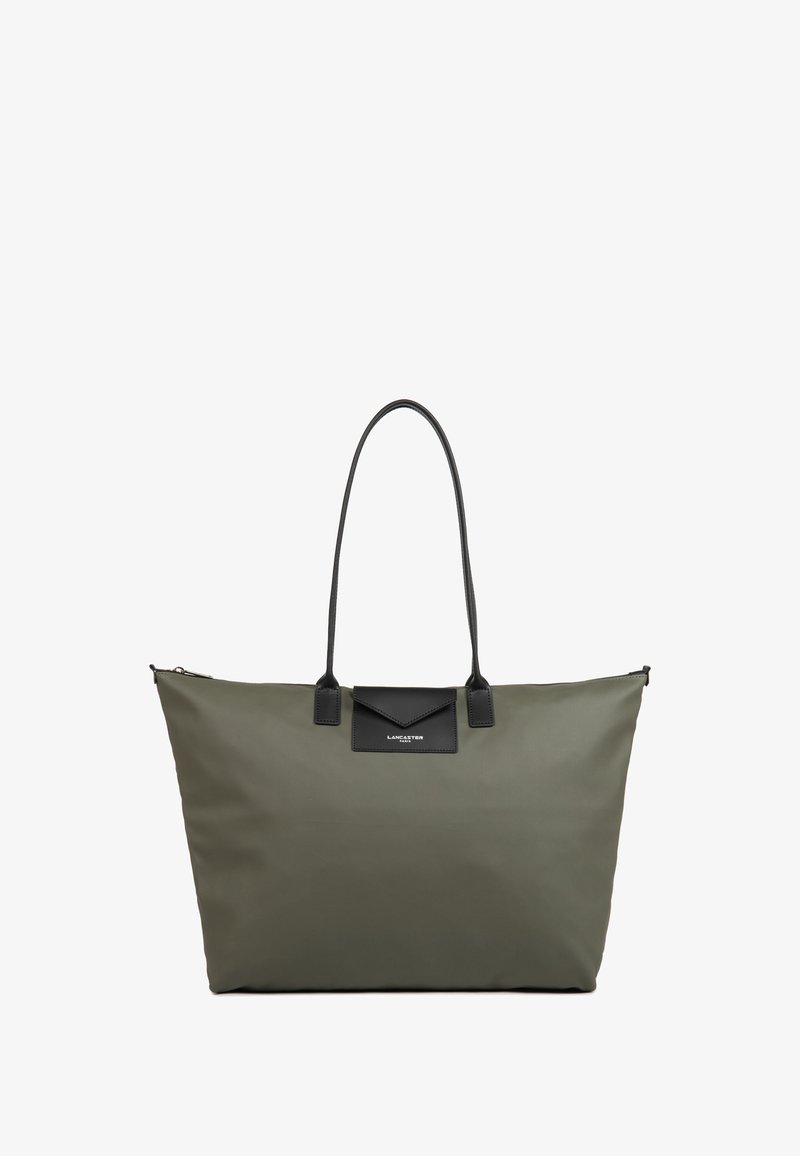Borsa a spalla verde oliva realizzata in materiale resistente, con un accento in pelle nera, due manici robusti e una chiusura con zip nella parte superiore.