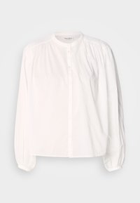 Blouse blanche à manches longues avec col mao, boutonnage devant, épaules plissées et poignets élastiqués.