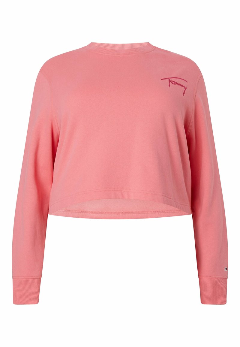 Sweatshirt court rose avec des manches longues, des bords côtes et un col rond. Présente un logo brodé "Tommy" sur la poitrine.