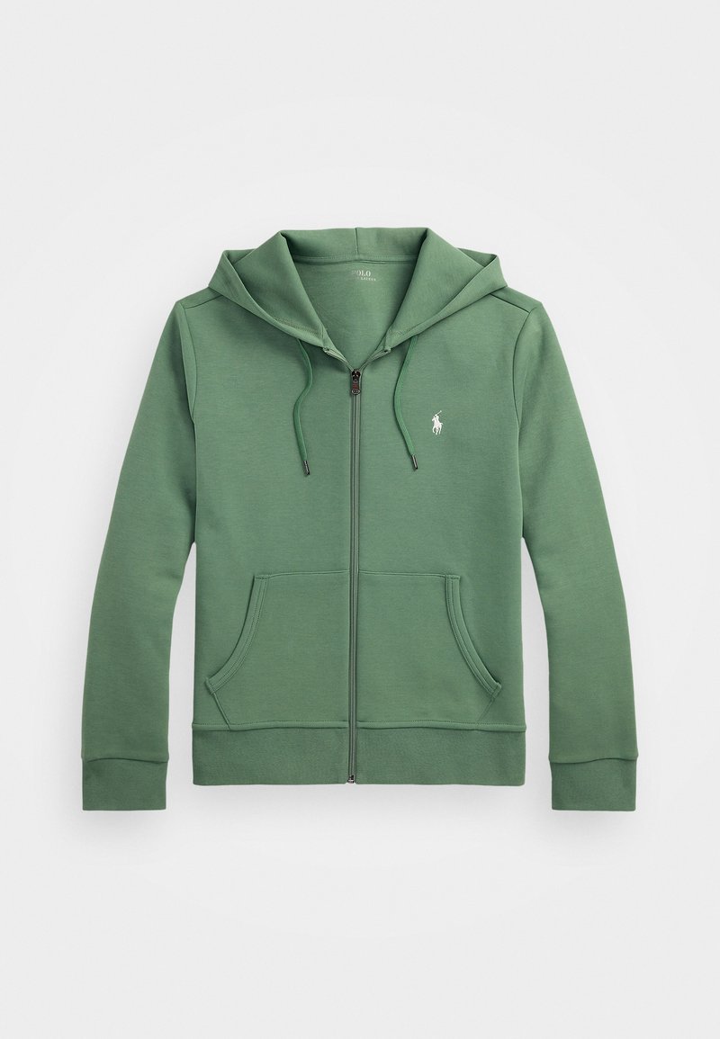 Grønn zip-up hettegenser laget av mykt stoff, med en stor hette, to frontlommer og en liten brodert logo på brystet.