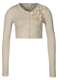 Beige kort cardigan med långa ärmar, rund halsringning, knappstängning framtill och dekorativa rosettaccenter på vänstra axeln. Strukturerad stickad tyg.