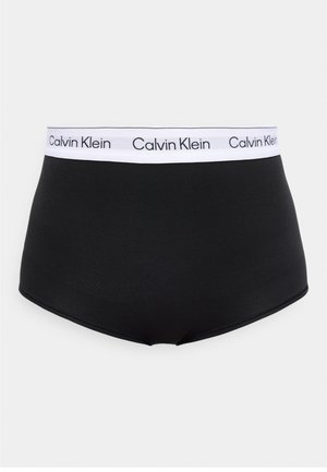 Μαύροι σλιπ με ψηλή μέση και λευκή ελαστική μέση που φέρει επαναλαμβανόμενο λογότυπο "Calvin Klein" με μαύρα γράμματα.