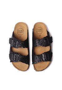 Sandali neri intrecciati con due fibbie regolabili, con un sottopiede beige e un logo rotondo sulla soletta, misura 37, design con suola piatta.