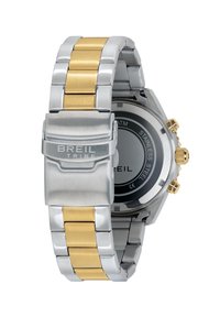 Montre en acier inoxydable argent et or avec une finition polie, dotée d'un cadran rond noir et de trois couronnes sur le côté.