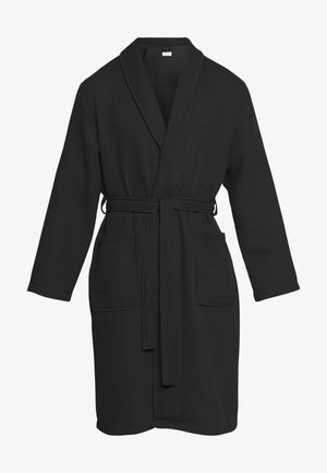 Melns vafļu tekstūras peldmētelis ar šalu jaku, paša sasienamu jostu un divām priekšējām kabatām. Garas piedurknes un ceļgala garuma dizains.