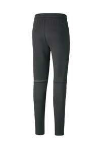 Zwarte sportbroek met een slim fit, elastische tailleband, zijzakken en reflecterende accenten op de onderbenen. Soepele stofstructuur.