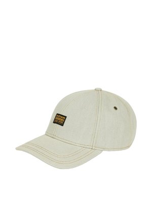 Beige baseballpet met een gebogen klep en een zwarte G-Star Originals logo patch op het voorpaneel.