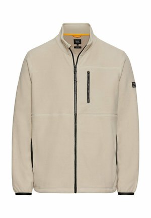 Beige fleecjas met een hoge kraag, volledige ritssluiting aan de voorkant, zwarte rits borstzak en contrasterende zwarte zijpanelen.