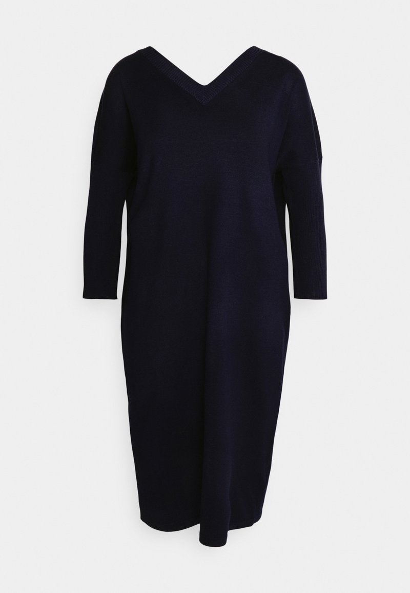 Robe en maille bleu marine à manches longues avec col en V et coupe décontractée, longueur genou, présentée sur fond blanc.