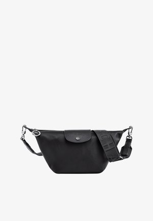 Black leather bag with a curved shape, top zipper closure, and adjustable strap featuring embossed logo patterns. Subtle branding on flap.