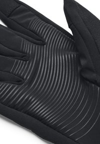 Schwarze Handschuhinnenseite mit erhöhten, geschwungenen Gummigrip-Linien und weichem Stoff an den Fingern und am Handgelenk.