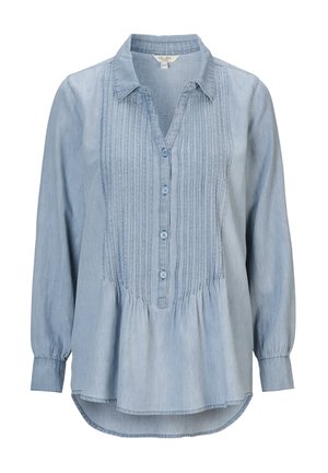 Ljusblå denimblus med långa ärmar, knäppning fram och plisserad detalj. Har en peplumkjol och krage.