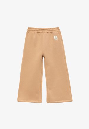 Beige brede bukser lavet af blødt stof med et elastisk taljebånd og et lille logo på fronten. Minimalistisk design og glat tekstur.