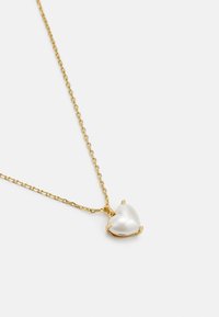 Gold-tone chain necklace featuring a heart-shaped pendant made of smooth, white pearl, showing a polished surface and secure setting.