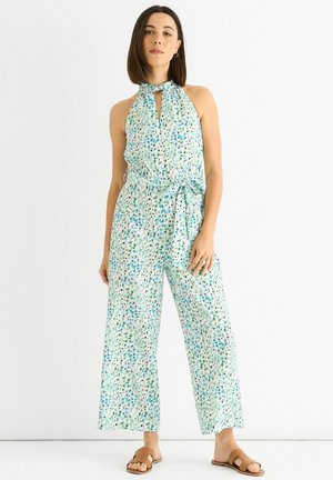 Lightweight jumpsuit with a halter neck and tie waist, featuring a green and blue abstract print on a white background. Wide-leg design.