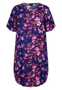 Tunique à manches courtes en fleurie de couleur bleu marine avec des motifs de fleurs roses et rouges. Possède un devant à boutons et un ourlet arrondi.