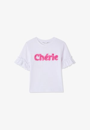 T-shirt bianca a maniche corte con maniche arruffate e testo rosa peloso con la scritta "Chérie" sulla parte anteriore. Tessuto in cotone, scollo rotondo.