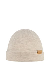 Light beige ribbed knit beanie with folded cuff and small brown leather tag on side against white background.