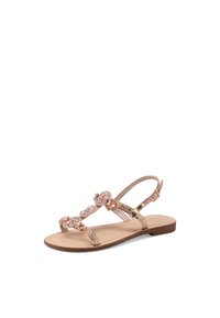 Sandalo con suola color cuoio e cinturini in rosè metallico. Presenta pietre decorative sulla parte superiore e una cinghia regolabile alla caviglia.