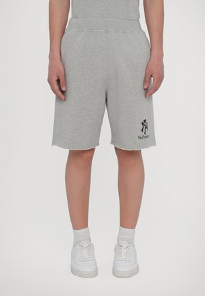 Gray sweat shorts made of cotton blend with an elastic waistband, side pockets, and a raw hem. Features a black logo graphic.